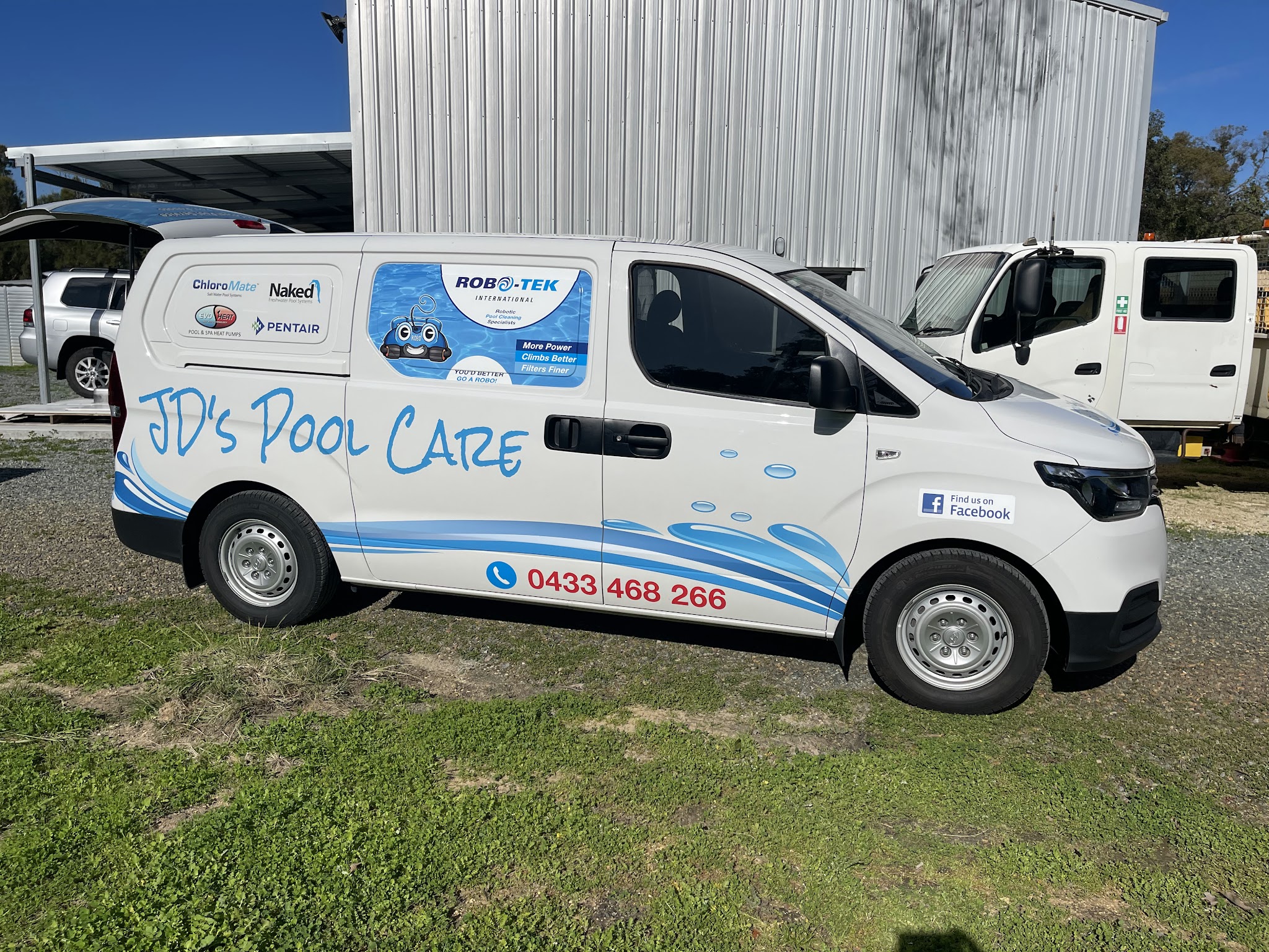 The JD's Pool Care service van, white with blue water graphics and the phone number on the side